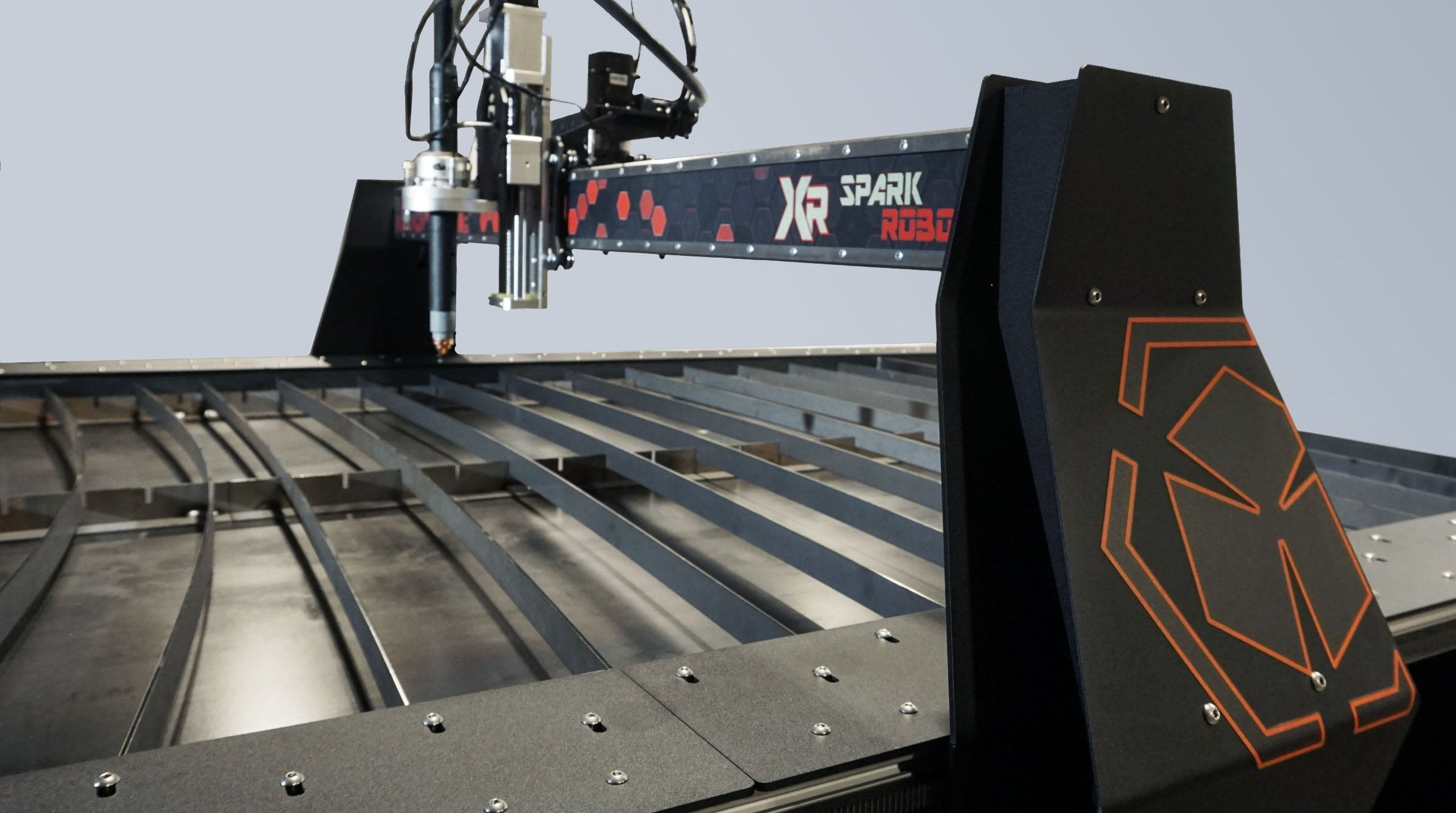 CNC machine with 'XR Spark' branding on a metallic surface