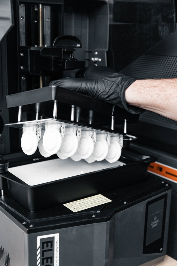 MSLA 3D prints being extracted from the printer