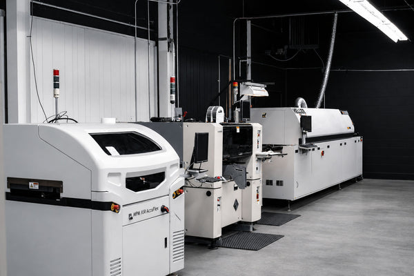 Industrial SMT machinery in a factory setting