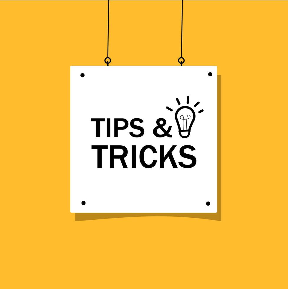 White sign with 'Tips & Tricks' text and light bulb icon on a yellow background
